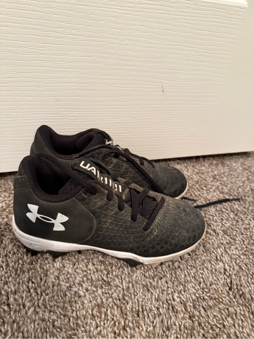 Under Armour Kids Black and White Athletic Cleats